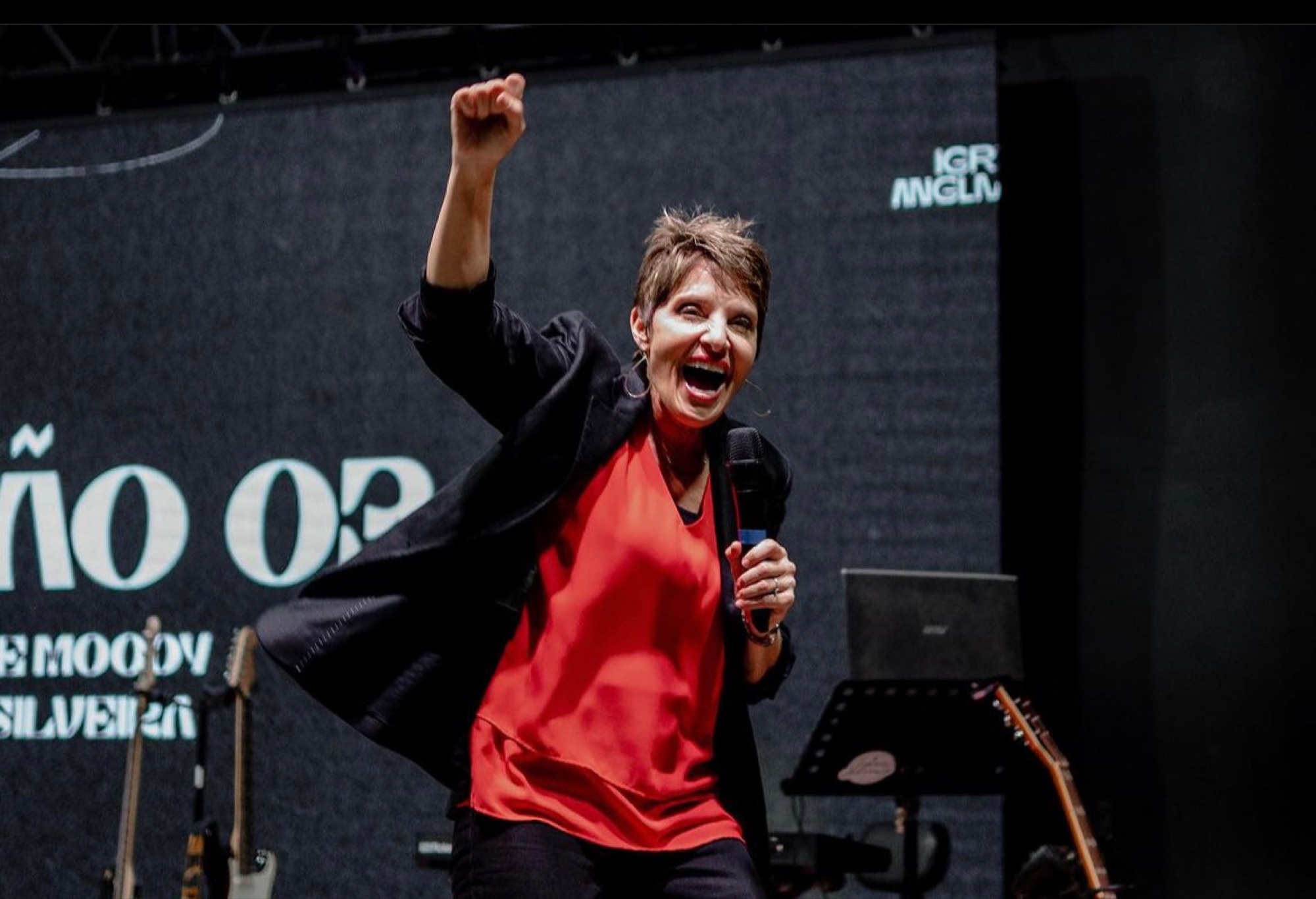 Rev. Joanne Moody ministering on stage
