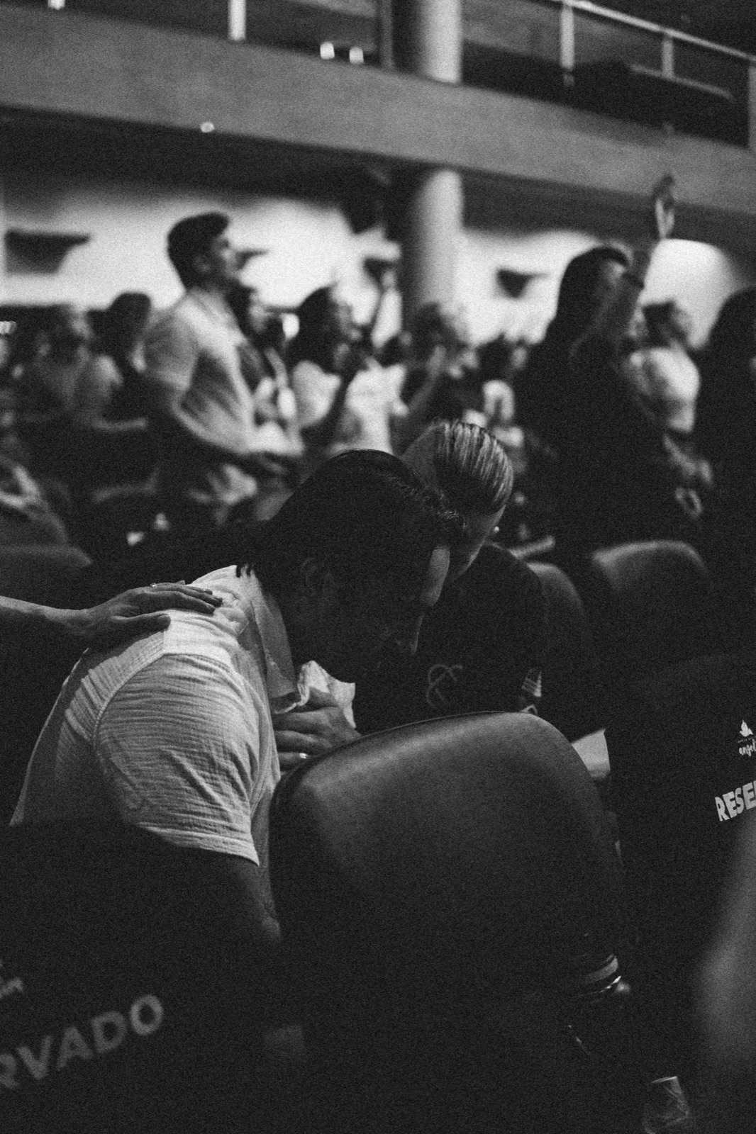 Believers praying over one another